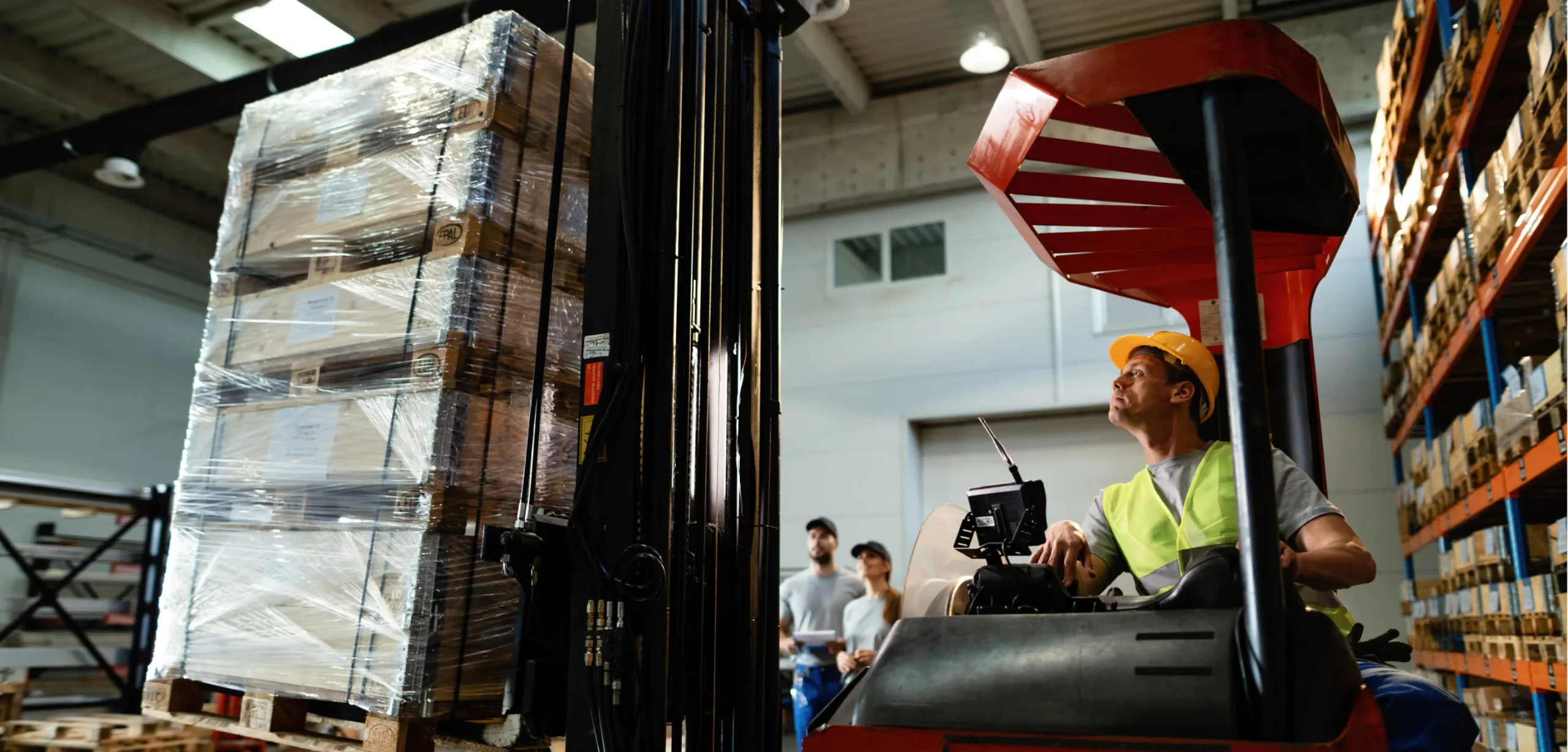 A warehouse worker operating a forklift to move cargo, demonstrating the efficiency and precision required in warehouse logistics.